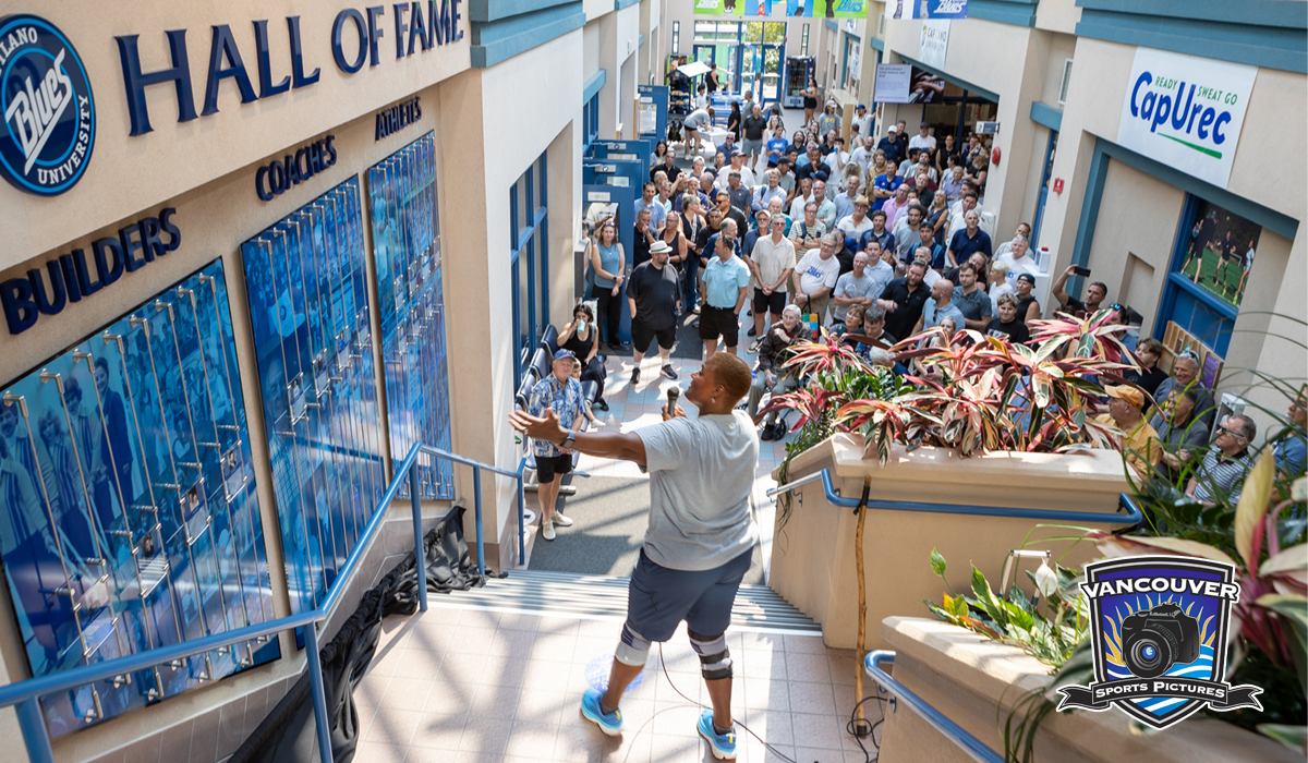 Director of Athletics and Recreation Georgette Reed addresses Blues alumni and fans at the unveiling of the Hall of Fame wall at CapU's Centre for Sport and Wellness Sept. 7. (Vancouver Sports Pictures)