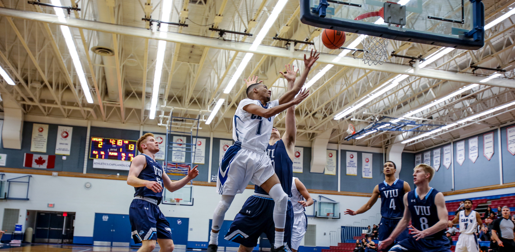 Point guard Brenden Bailey drives hard to the hoop against VIU. Photo Paul Yates / Vancouver Sports Pictures