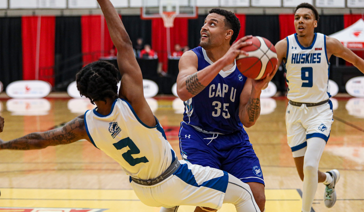 David Featherston muscles his way to the hoop in Capilano's opening game at the CCAA national championships against George Brown College.