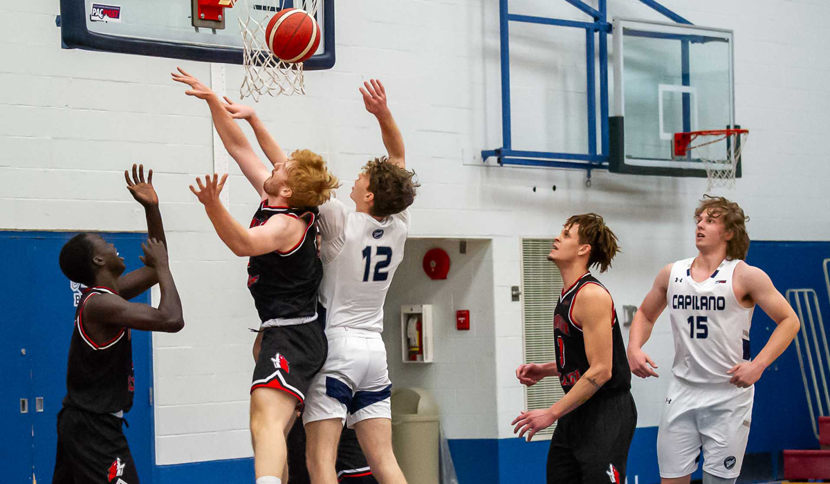 Capilano's Kash Lang (12) battles on the boards during an 80-68 home win over Okanagan College Feb. 9. (Photo courtesy of Isabella Patino)
