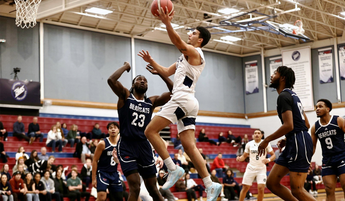 Blues rookie guard Arshya Ghasemi takes it to the tin Thursday as part of a loss to visiting CBC.