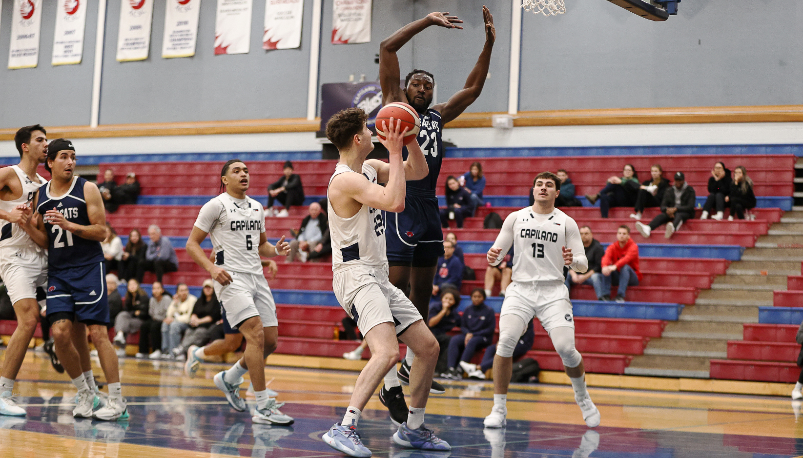 Russell Curley (23 in white) and the Capilano Blues split a weekend road set at CBC Feb. 16 and 17.