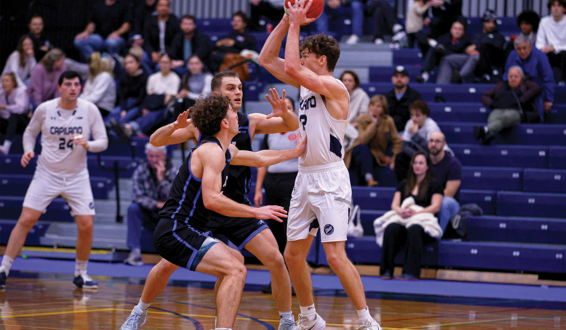 Kash Lang (with ball) matched a Blues career-high with 31 points Nov. 15 to help Capilano earn a split in a road trip to VIU. (Matt Carter photo)