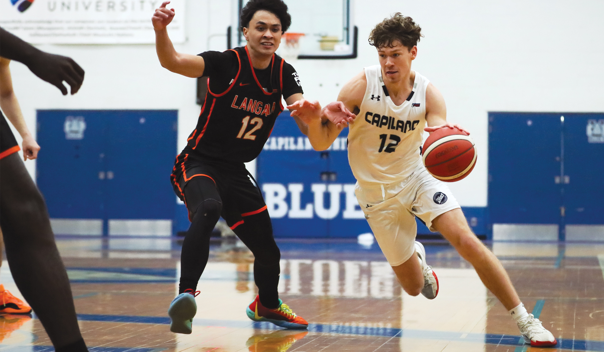 Kash Lang drives on Langara defender Joaquin Bautista during a Nov. 7 Blues home game against the Falcons (Braeden Yu photo)