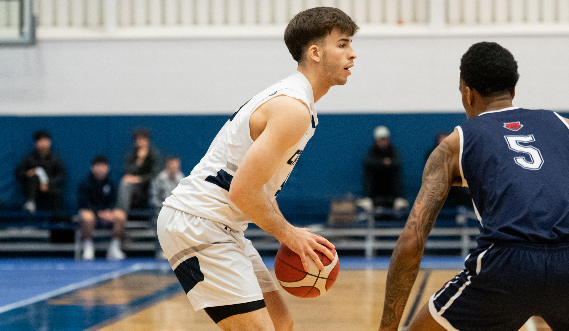 Alfonso Reyes scored 27 points in 27 minutes off the bench to help the Blues past Columbia Bible College in the PACWEST quarterfinals Thursday. (Athena Pimental photo)