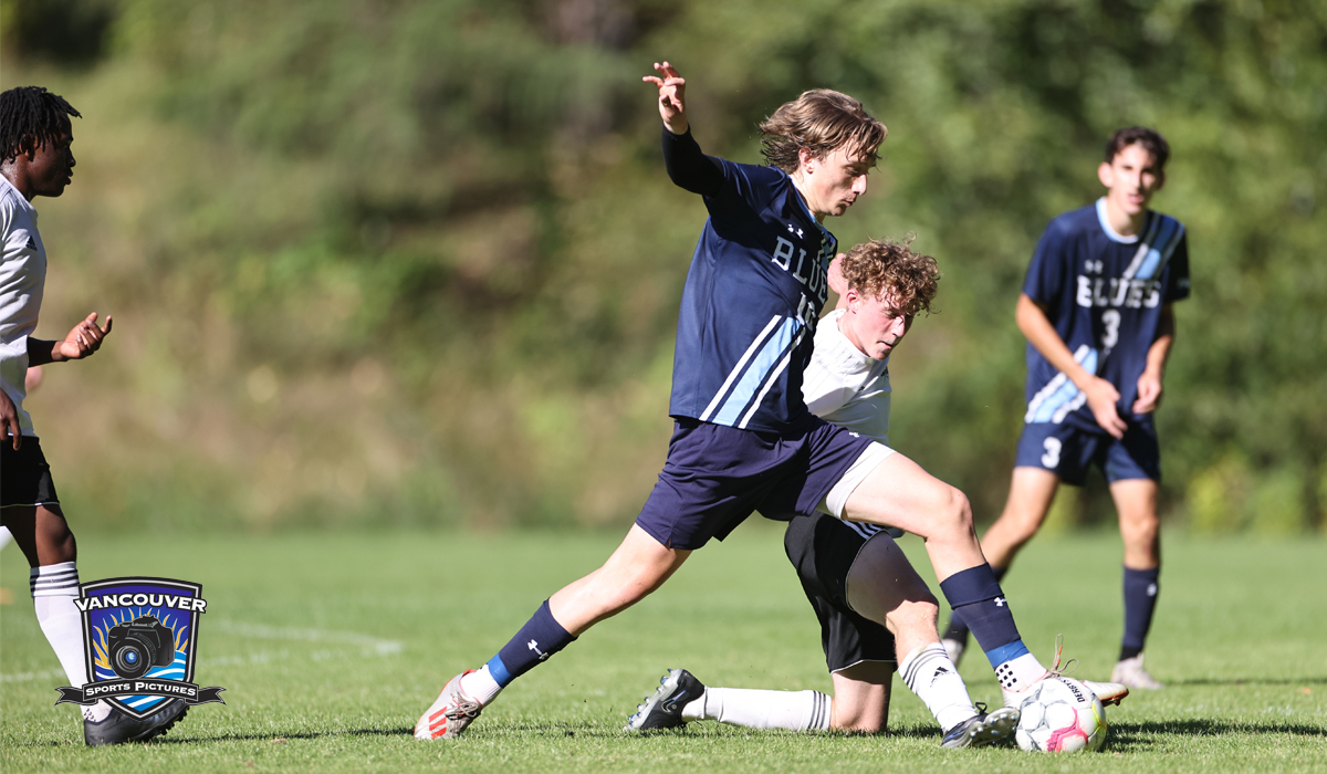 Capilano's Tommy Millar battles for possession during the team's season-opening 2-1 setback to VIU Saturday at Lillooet Park.