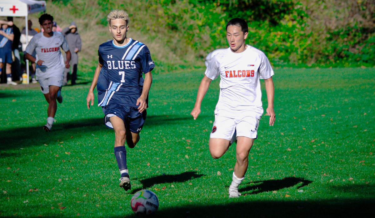 Sebastian Cirotto (7) in a foot race for the ball during a Blues 1-0 home win over Langara College Sept. 29. (Evan Meyer photo)