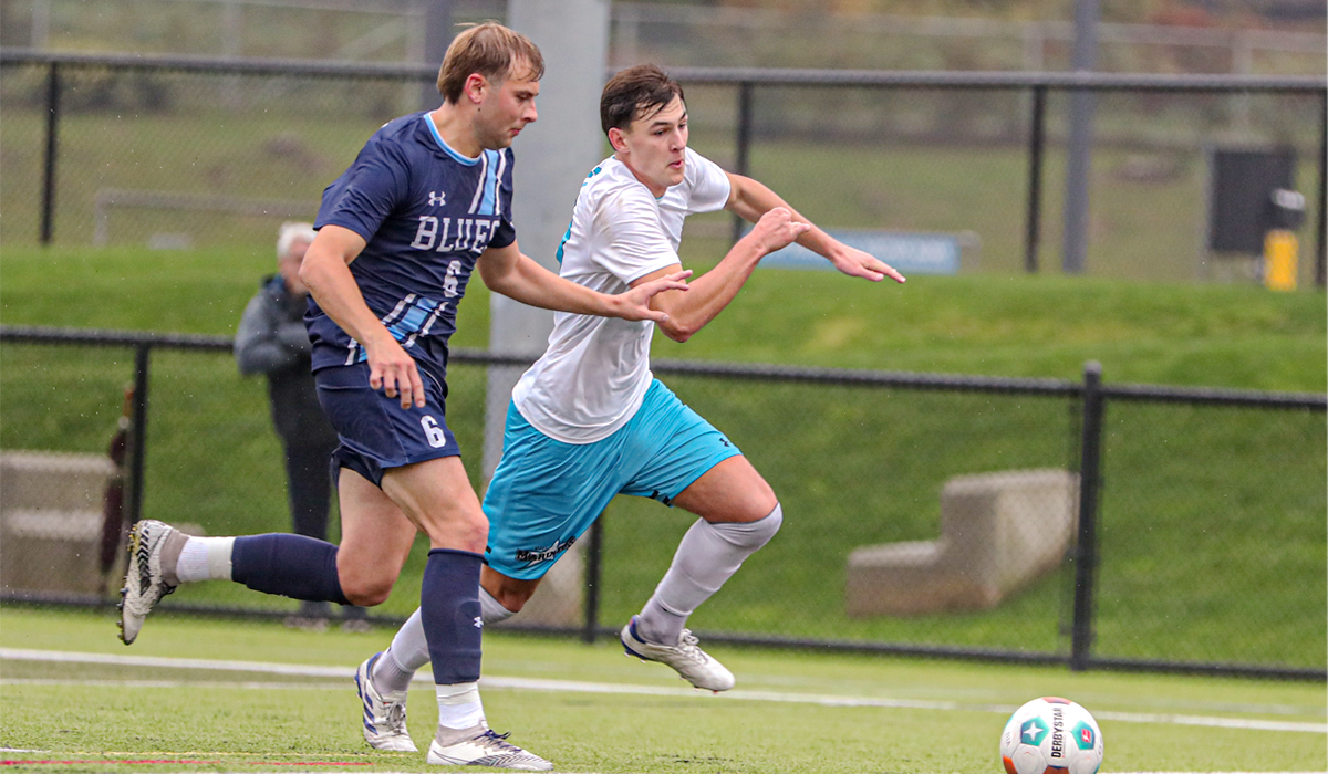 Capilano's Luca Dal Sasso challenges a VIU Mariners ballcarrier Saturday, Oct. 19 as part of a 2-1 Blues win. (Matt Carter/VIU Athletics)