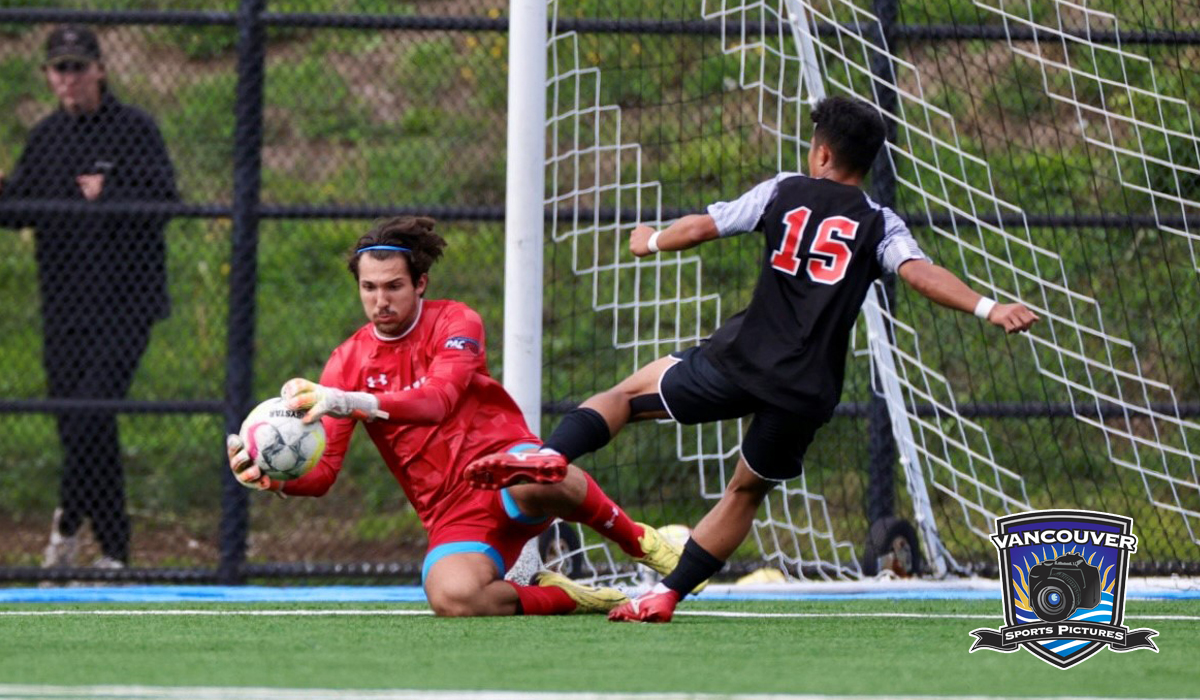 Capilano's Brandon Lecce (red kit) secures the ball during Oct. 6 action at CapU Squamish as the Blues hosted Langara. (Vancouver Sports Pictures)