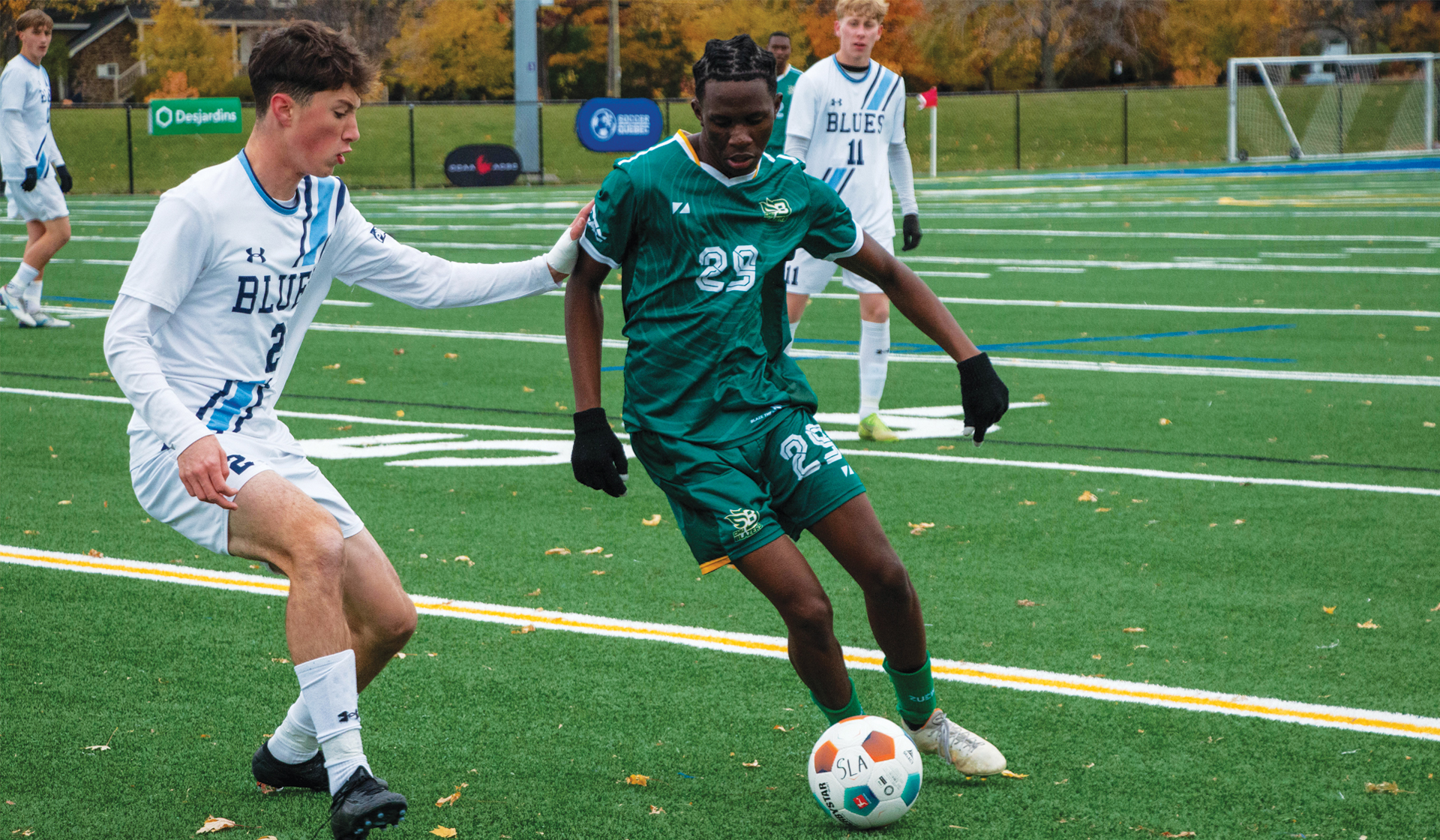 Capilano's Ben Ellsworth pressures Leju James of CMU in the placement game at the CCAA National Championship tournament.