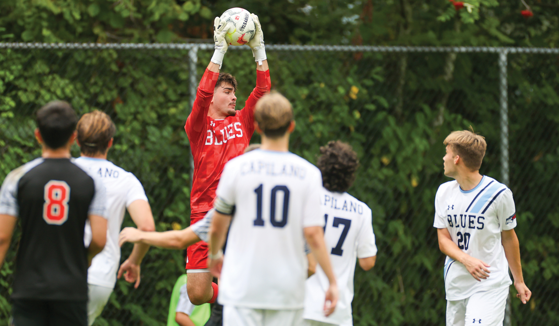 Graydon Sherle (in red) and the Capilano Blues recorded a tie and a loss for the weekend and will be the No. 3 seed for the PACWEST provincials.