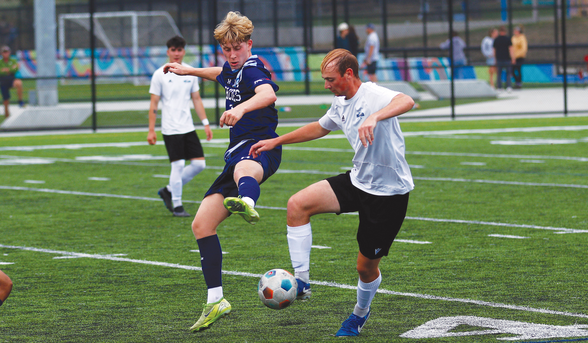 Capilano's Zach Gabrys (left) jostles with VIU's Josh Rayner for possession during a Sept. 20 match in Nanaimo. (VIU Mariners Athletics photo)