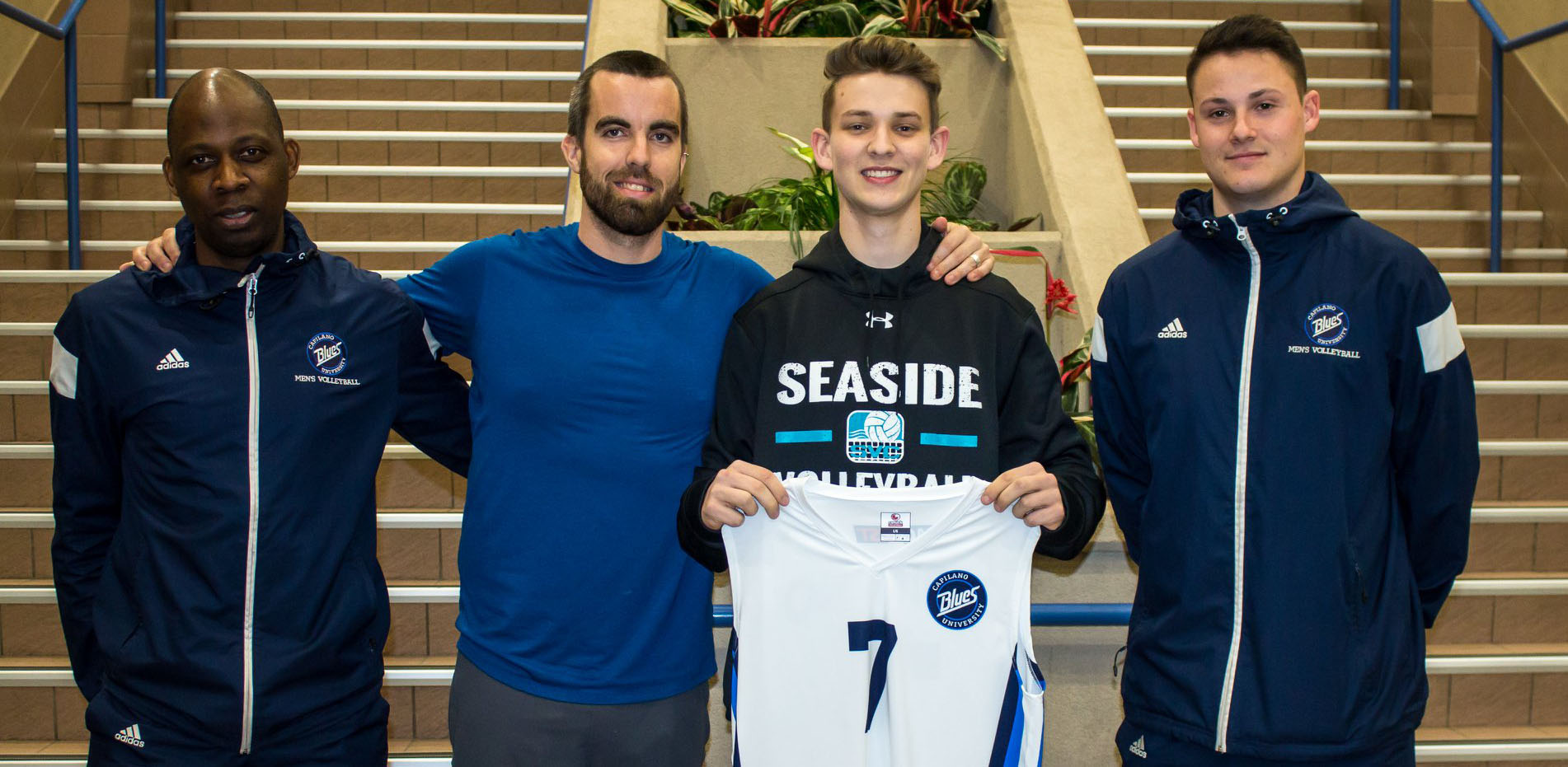 Head coach Dave Dooley (second from left) alongside Markus Bratsburg, past Bcoach Emmanuel Denguessi, and Taylor Hammond. Photo Chris Raeside, CapU