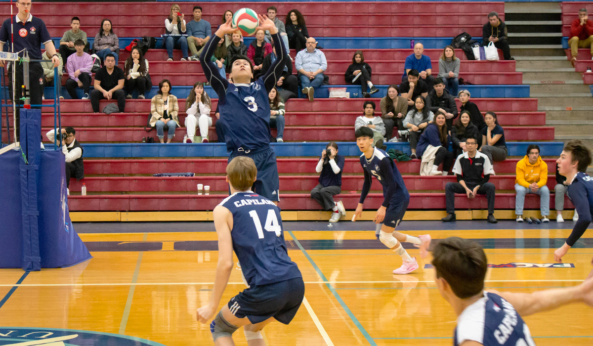 Jenson Yuen sets up the Blues attack against Camosun College Feb. 17. The graduating fourth-year setter concluded his Blues volleyball career with the weekend set against the Chargers. 