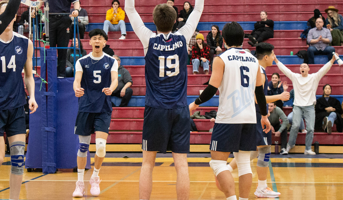 Jesse Lee and his Blues teammates react to a big kill during Friday's five-set home win over the College of the Rockies.