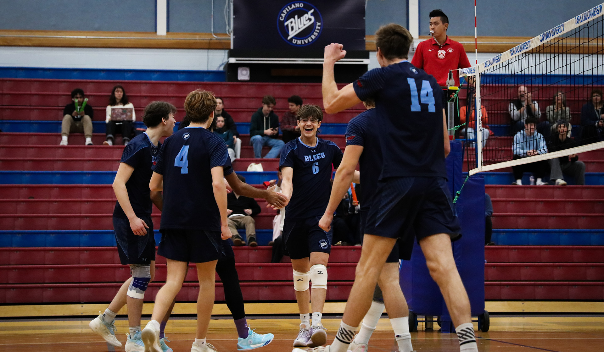 The Capilano Blues' bench celebrate scoring a point (Braeden Yu photo)
