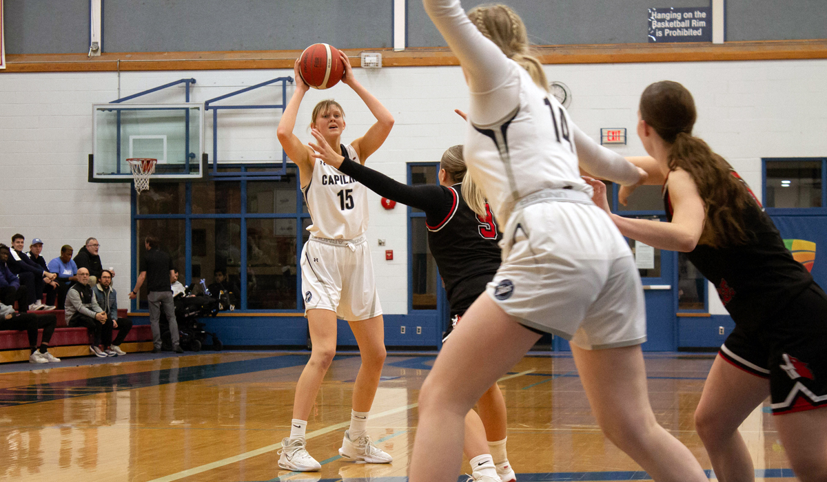 Ida Jonsson-Ojala looks for Maddie Coffin in the low block Friday, Dec. 2 in an 85-55 home win over Okanagan College.