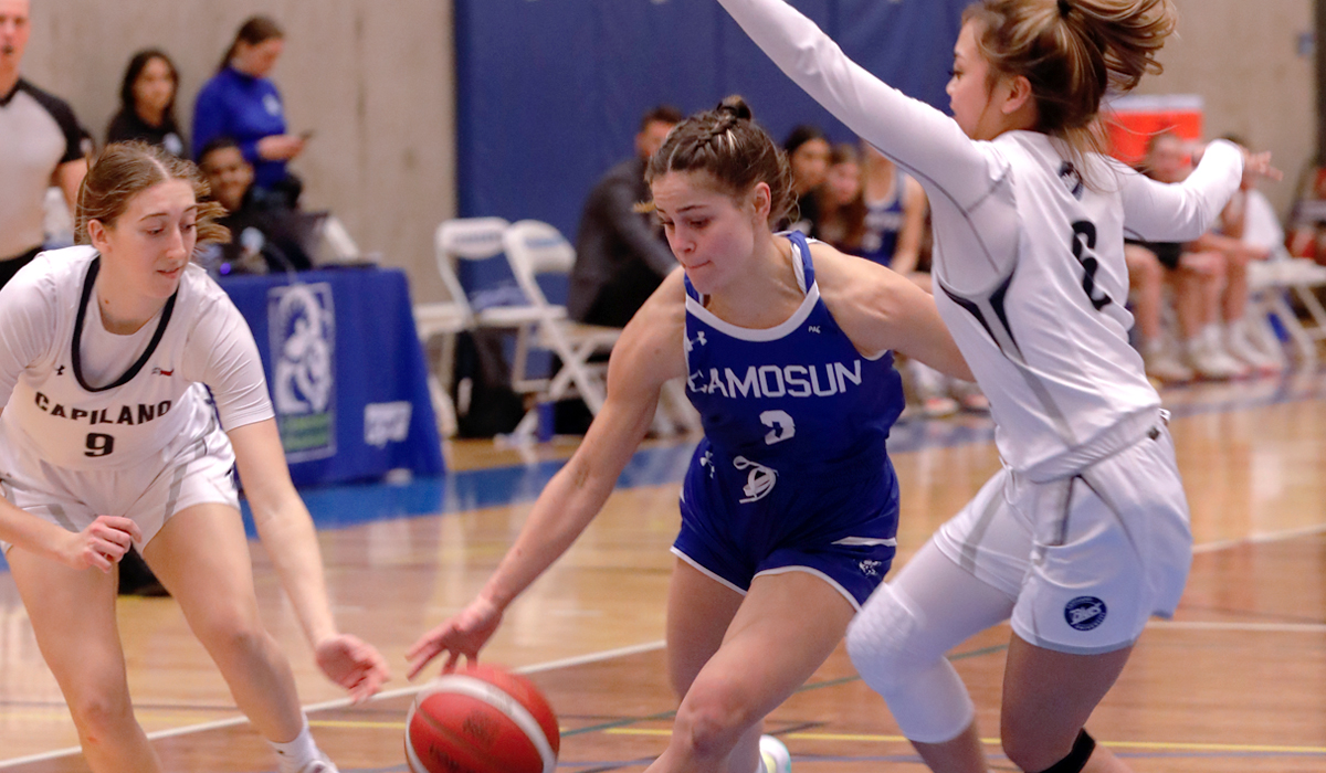 Alanya Davignon (left) and Kirsten Abo team up to defend Camosun guard Rhiannon Ware in a Jan. 21 win for the Blues.