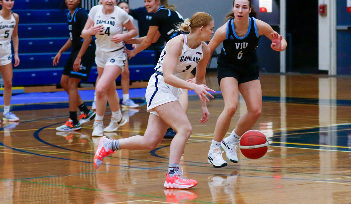 Lauren Tomlinson drives on VIU Mariners guard Mackenzie Cox in the opener of two-game set in Nanaimo, both wins for the Mariners (photo courtesy of Matt Carter/VIU Mariners).
