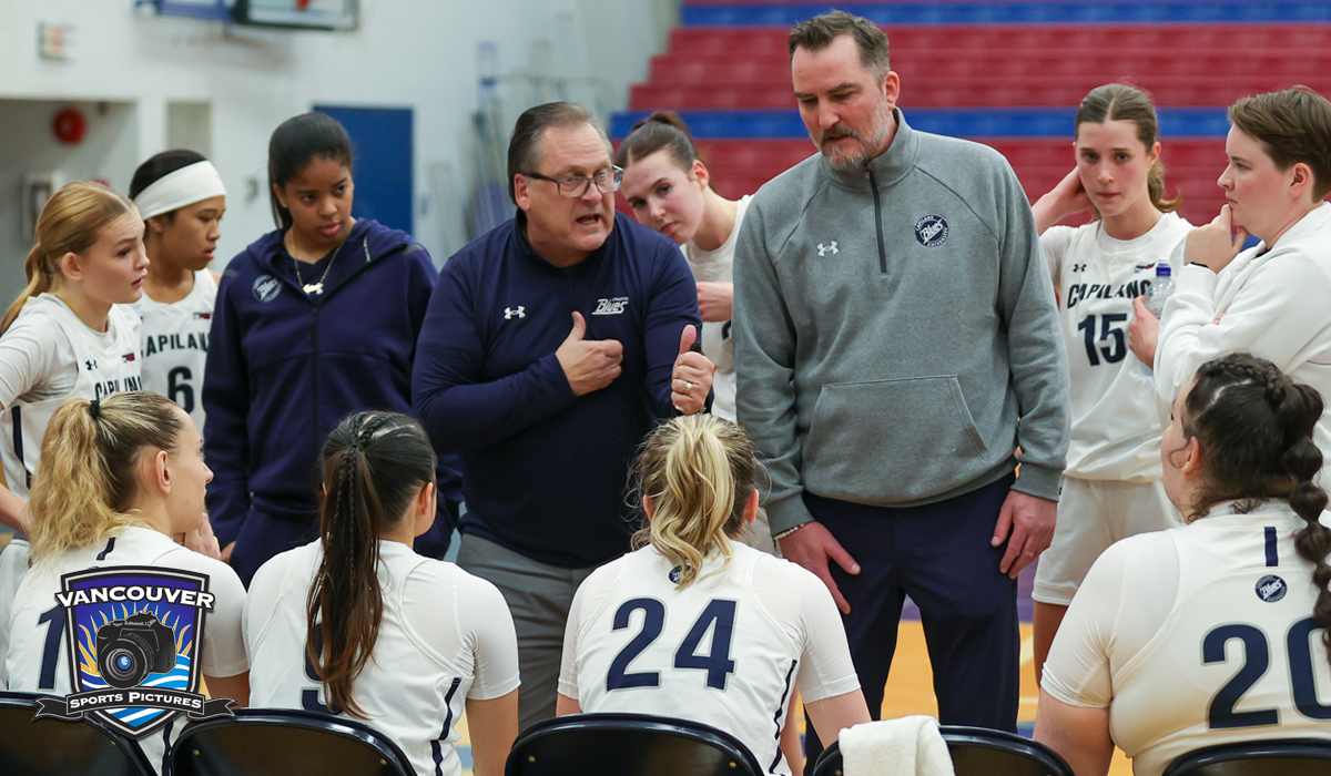 Blues coaches Ross Tomlinson (left) and Chris Weimer discuss adjustments during a timeout. CapU dropped a pair of games at Douglas Jan. 24-25. (Vancouver Sports Pictures)
