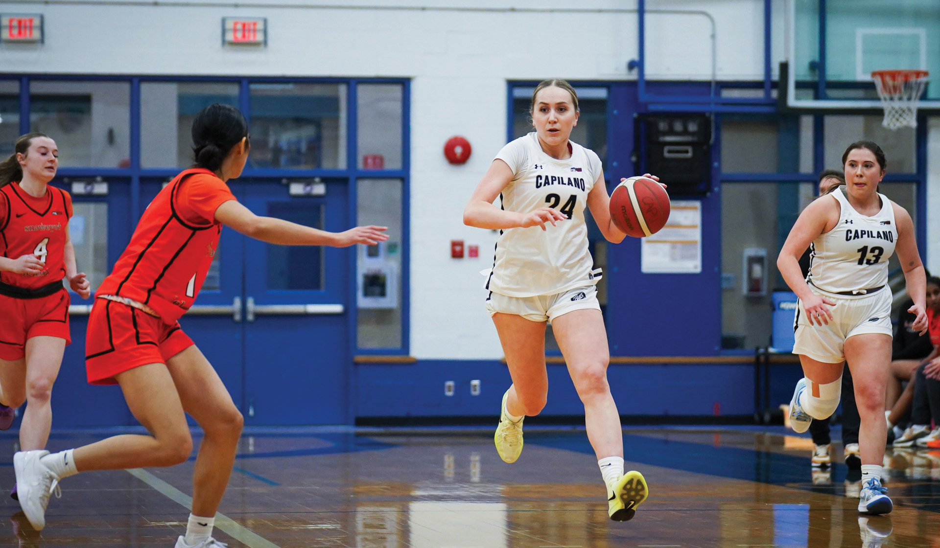 Maddy Coffin (24) and the Capilano Blues dropped a razor-thin 58-56 decision to the Langara Falcons Feb. 21 at CapU. (Braeden Yu photo)