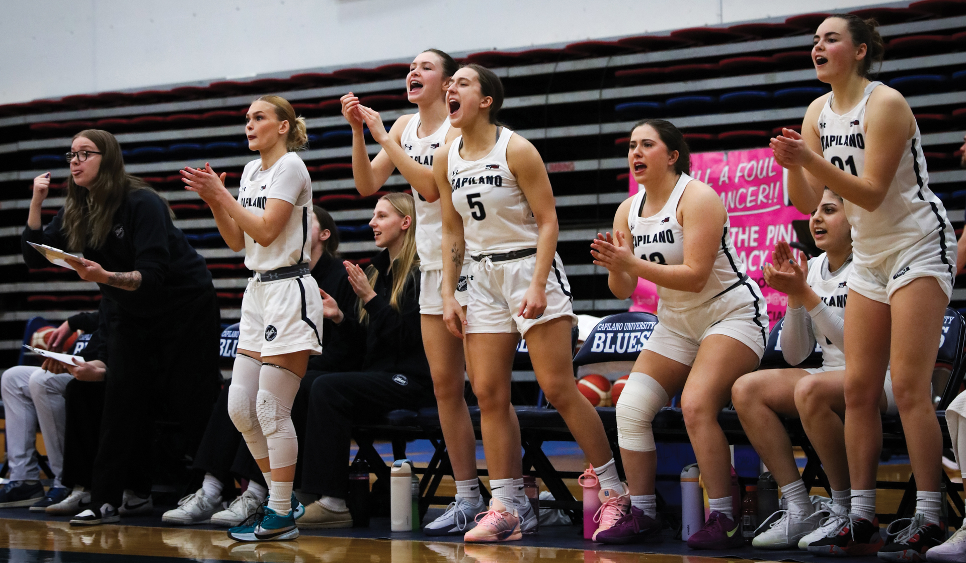 Blues bench reacts during a 74-53 home win Feb. 6 over Douglas College Royals. (Braeden Yu Photo)