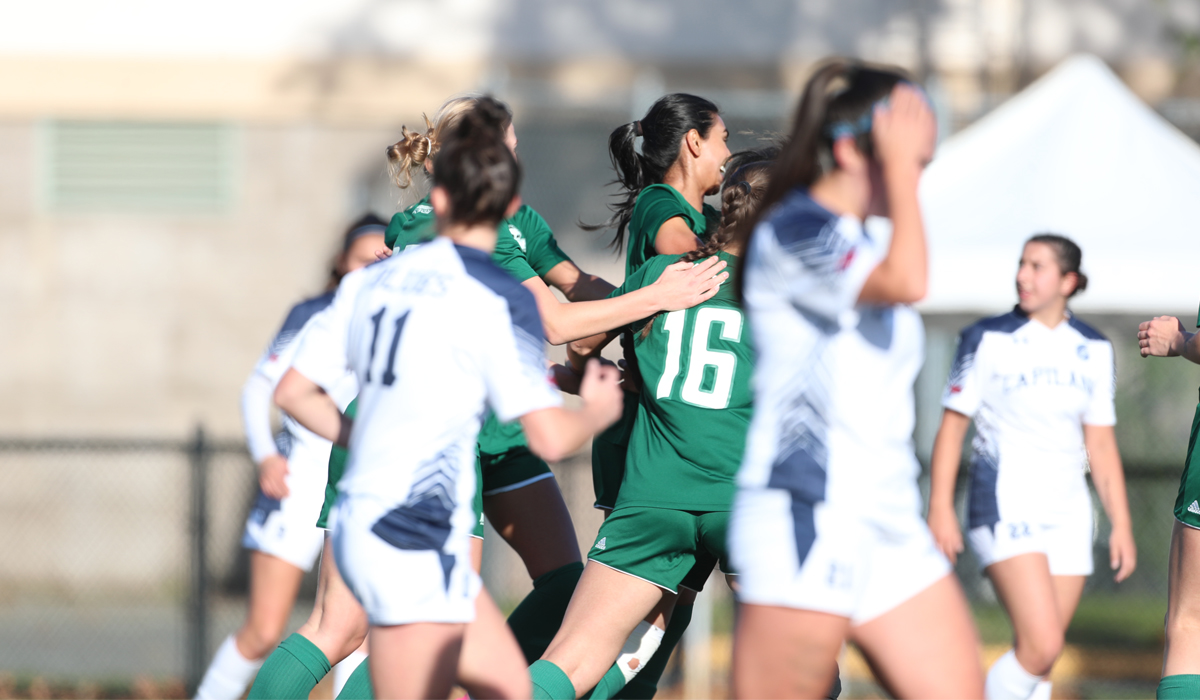 Blues players Maya Smith and Aynsley Hurtado (foreground) gather themselves after a Douglas College goal in Sunday's PACWEST title game.