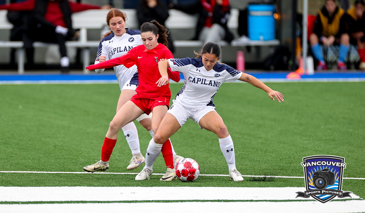 Alexis King (front) and Isabella Bolognese battle for possession against Seneca as part of a 1-0 win Friday, Nov. 8 as the Blues gained entry to the bronze-medal game against VIU. (Vancouver Sports Pictures)