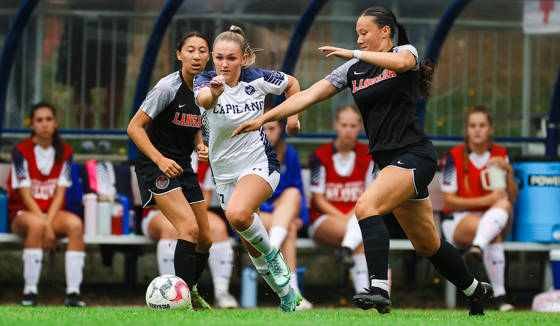 Kaitlyn Johnson on the attack surrounded by defenders (Vancouver Sports Pictures)
