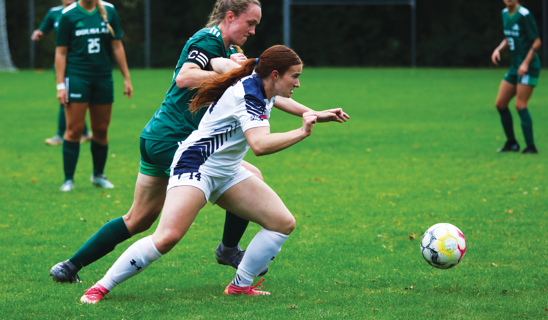Isabella Bolognese (white) was a rock on the Blues back line, keeping PACWEST leading scorer Isabelle Dobbin off the scoresheet Oct. 4 and 5. (Braden Yu photo)