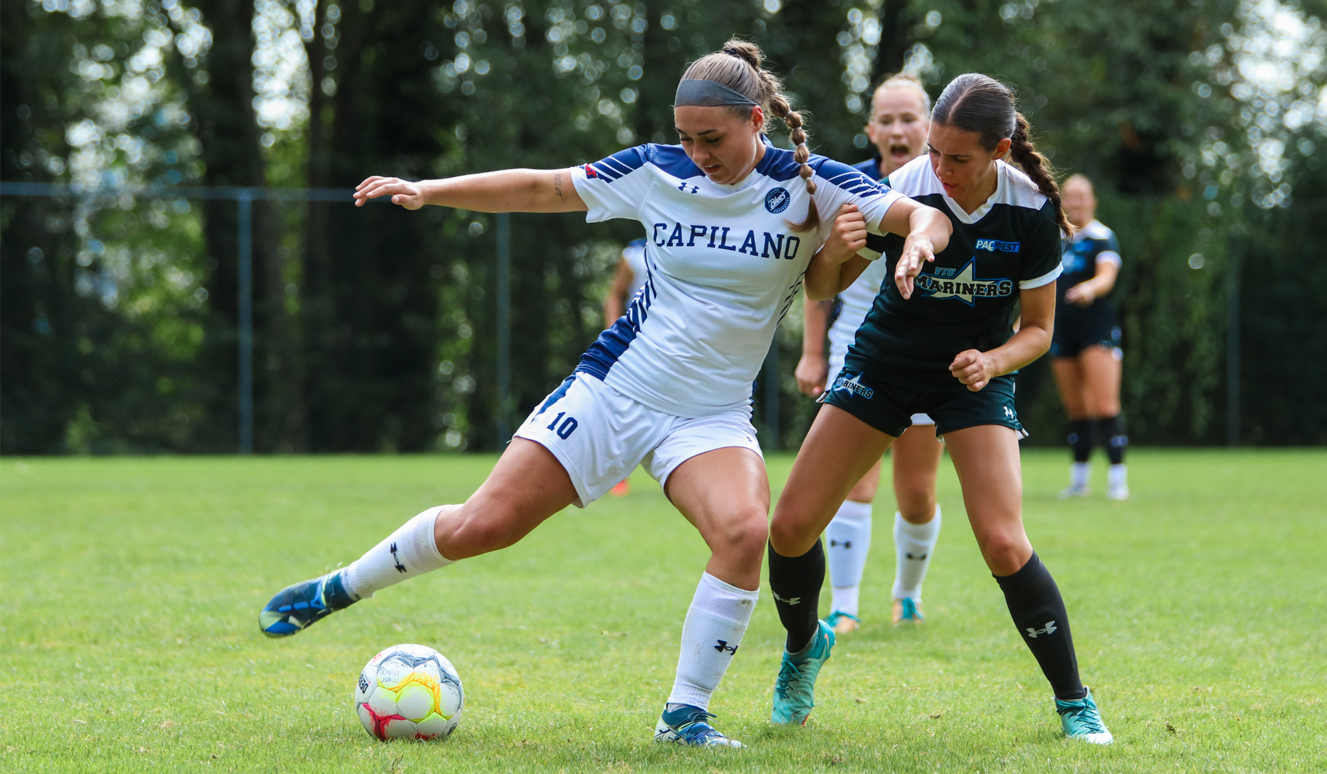 Catelyn Kendall battles for possession during Blues home 5-2 loss Sept 13 to VIU. (Braeden Yu Photo)