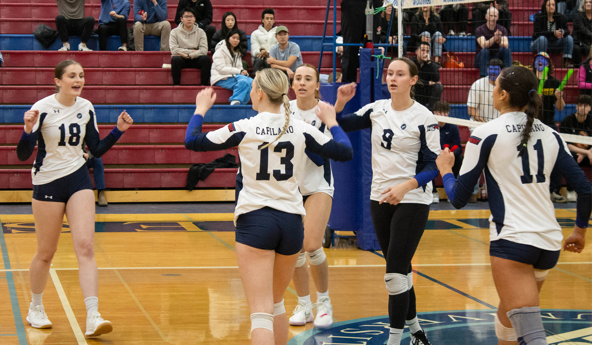 Blues players (left to right) Ashley LeSage, Sophie Yarish, Maya Jovic, Melissa Pesch and Aimee Tilley react to a point won Saturday as part of a 3-0 home win over the College of the Rockies.