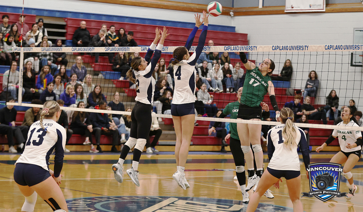 Vanesa Gatto (2) and Natalie Rourke (4) get in on a block as part of a loss to Douglas College Feb. 2.