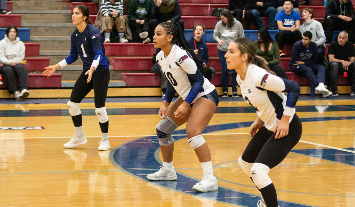 (Left to right) Anika Gatto, Nnya Mbaoma and Vanesa Gatto await a serve against the VIU Mariners Nov. 17.