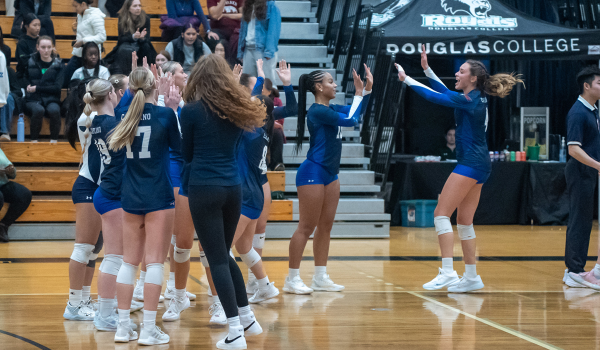 Capilano Blues players were all smiles in the high-five line after a straight-sets victory Friday, Jan. 10 at Douglas College. (Chris Raeside photo)