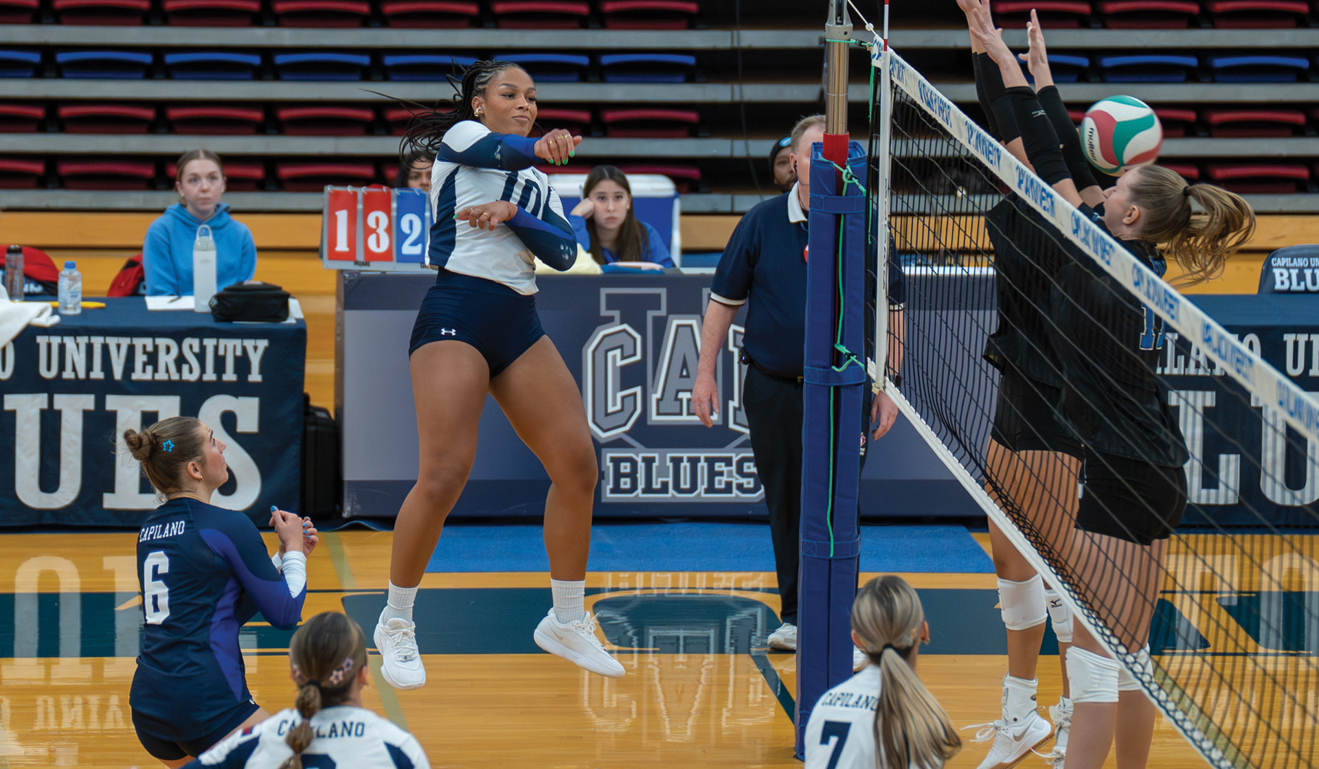 Nnya Mbaoma (10) puts away one of her 16 kills on the night Nov. 14 in a Blues 3-1 win over visiting VIU. (Chris Raeside photo)