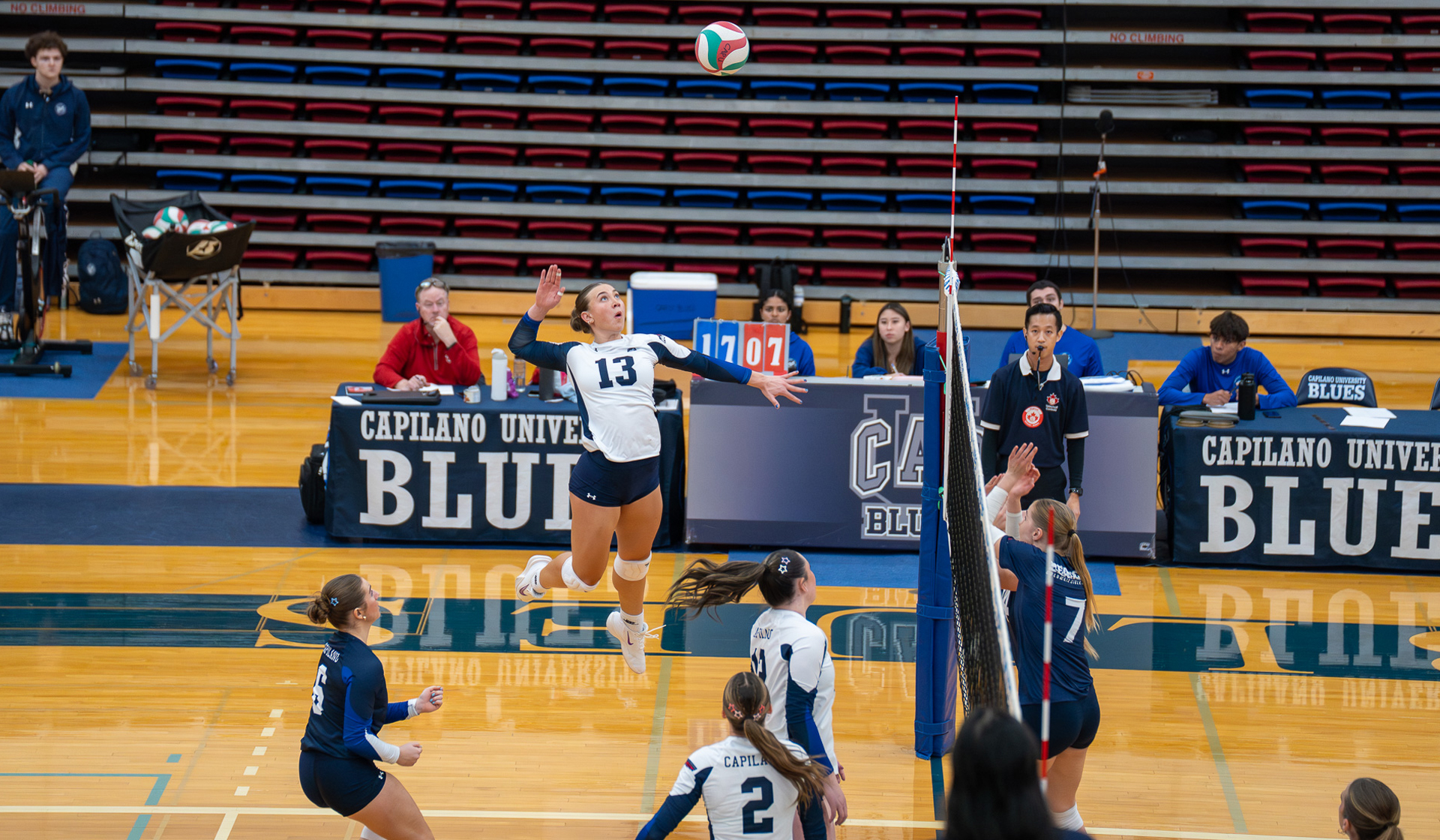 Abby Betker rises up for a big swing as part of a 3-0 Capilano Blues home win over Columbia Bible College Nov. 21. (Chris Raeside photo)